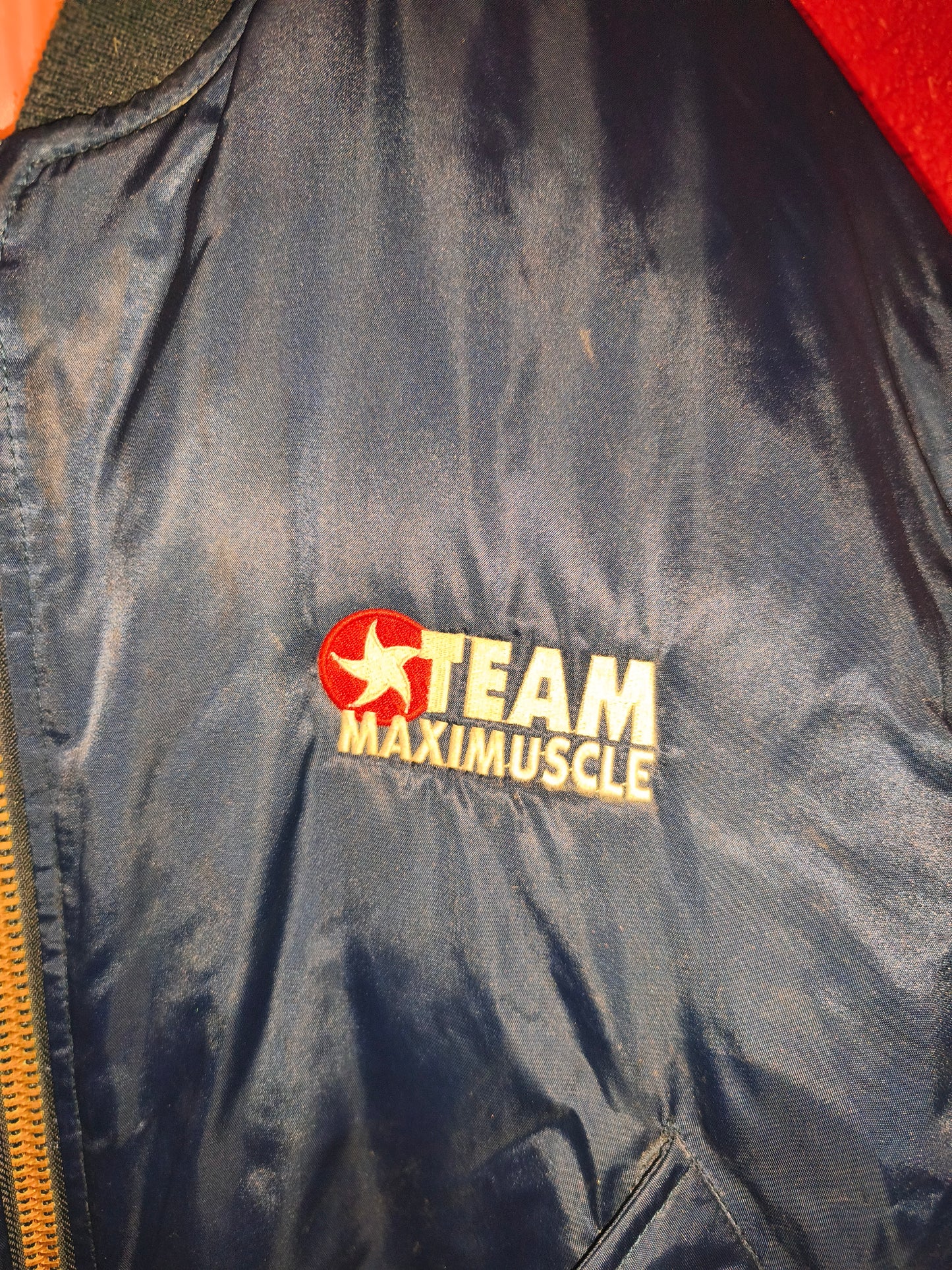 Classic 90s/Y2K bomber jacket featuring bold "Team Maximuscle" chest & back embroidery!