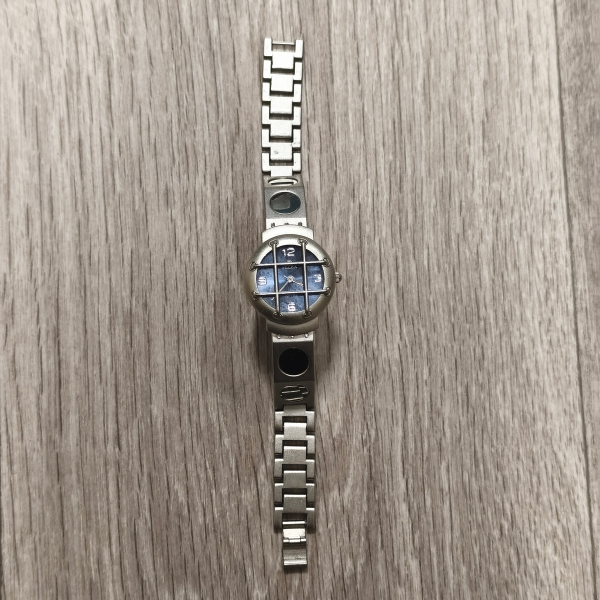 PELEX Quartz Blue Dial Stainless Steel Back Water Resistant Watch Cage Detail