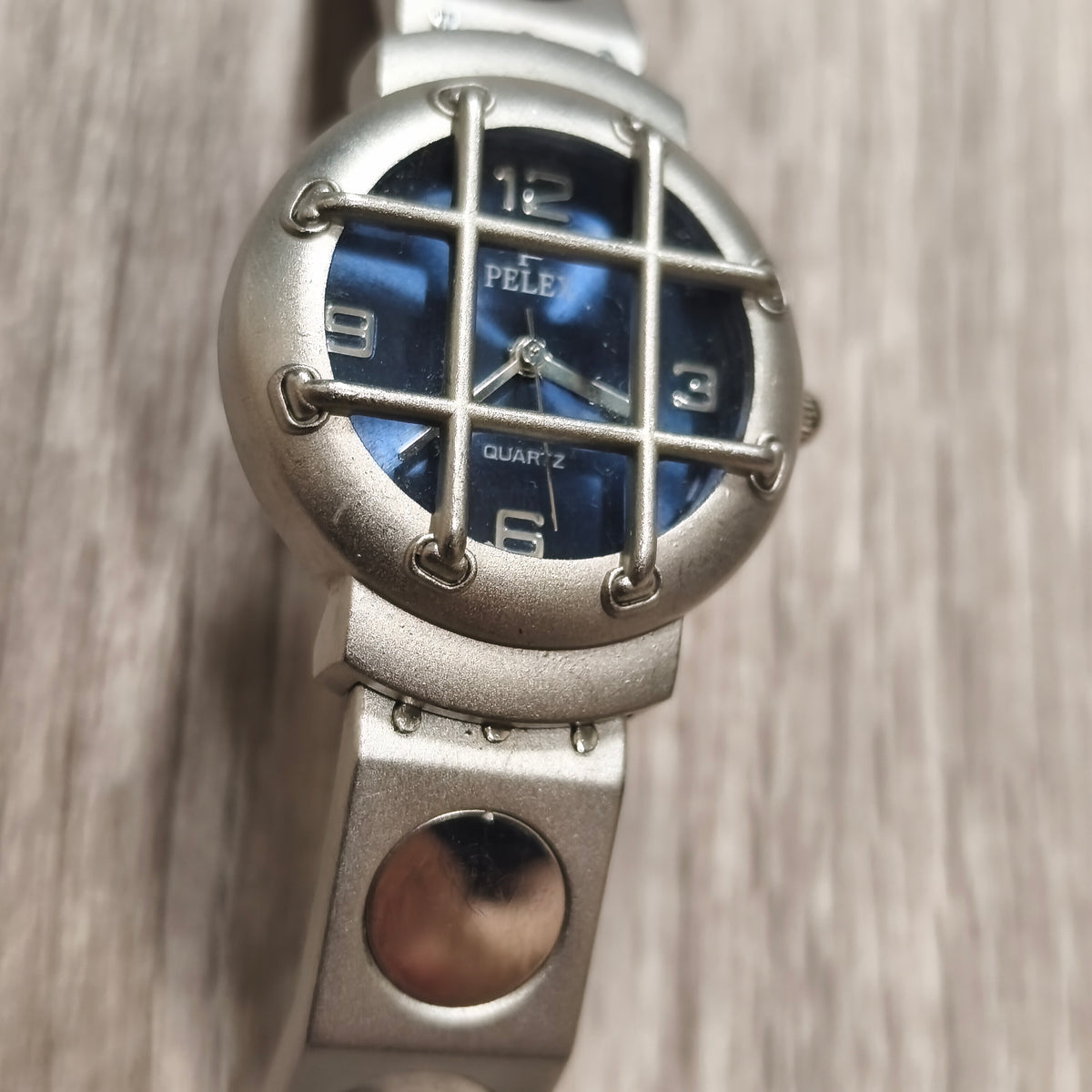 PELEX Quartz Blue Dial Stainless Steel Back Water Resistant Watch Cage Detail