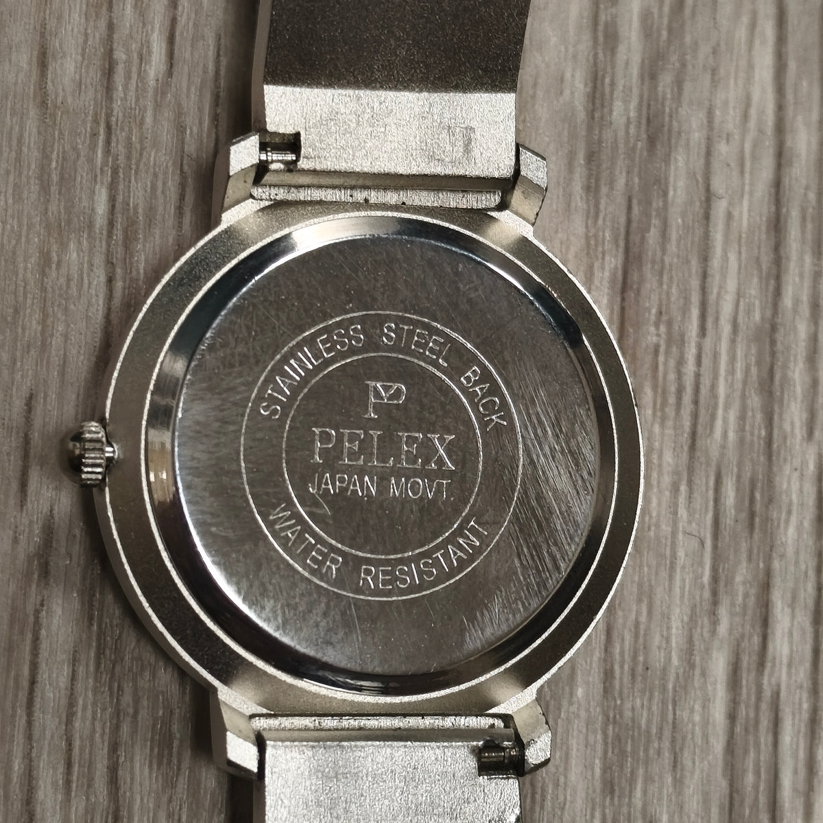 PELEX Quartz Blue Dial Stainless Steel Back Water Resistant Watch Cage Detail